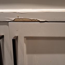Cabinet Cures of the Triangle - Peeling near sink.