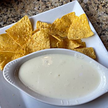 Mi Tequila - Queso cheese sauce with chips - Mexican Near Me - Petoskey, Michigan