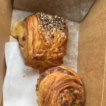 La Fillette Bakery - Ham and cheese croissant (top), green chili savory roll (bottom) - Bakeries Near Me - Denver, Colorado La Fillette Bakery - Ham and cheese croissant (top), green chili savory roll (bottom) - Bakeries Near Me - Denver, Colorado
