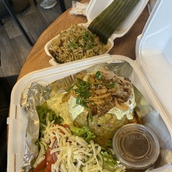 Twisted Taino Restaurant - Stuffed Mofongo with a side of arroz malposteao - Latin American Near Me - Parma, Ohio