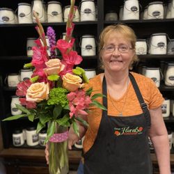 Osage Floral & Gifts - Owner, Linda, with a beautiful arrangement.