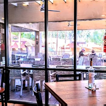Kimbles Kitchen - From inside you can see the ample patio dining area - New American Near Me - Surprise, Arizona Kimbles Kitchen - From inside you can see the ample patio dining area - New American Near Me - Surprise, Arizona