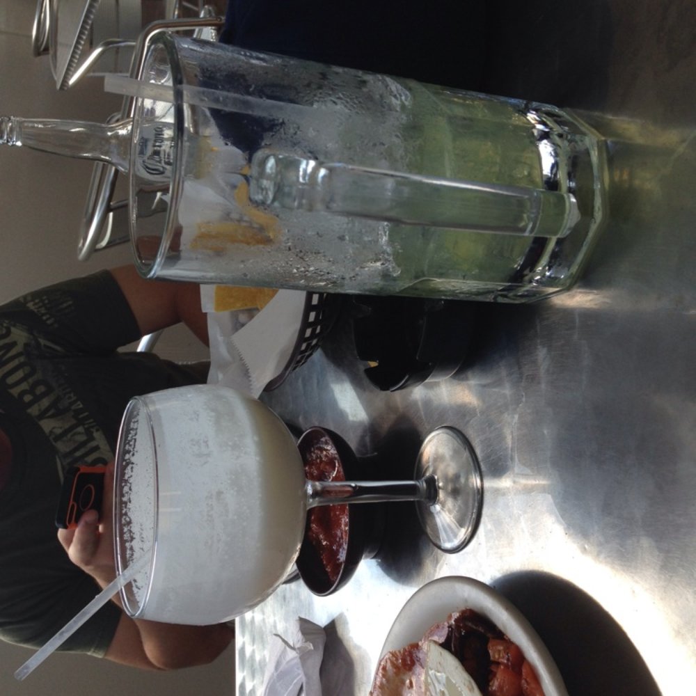 a man standing in front of a blender and a plate of food a man standing in front of a blender and a plate of food