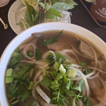 Pho Saigon 1 - The garnish is above the soup shows you how much protein and noodles they aren't spared to give you. With every dime! - Vietnamese Near Me - Chatsworth, California