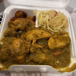 Jamaica Spice Paradise - Curried chicken with a side of plantain and cabbage