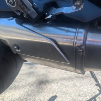 Nault's Powersports - Damaged muffler from the foot peg breaking off into it in the crash - Motorcycle Dealers Near Me - Manchester, New Hampshire