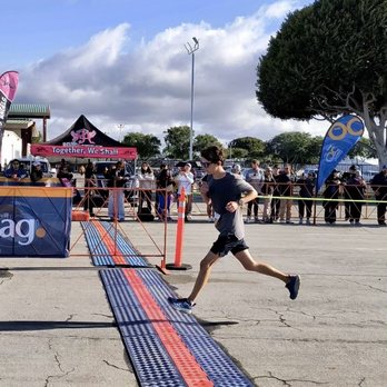 OC Marathon - Son crossing his first half at the OC half (2024) - Races & Competitions Near Me - Costa Mesa, California