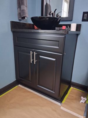 BUILT IN CABINET REPAINT 2025 - IN A BEAUTIFUL HOME LOCATED IN OCALA PALMS THESE CUSTOMERS FAVORITE COLOR IS BLACK!
So you can understand why the original built in cabinets weren’t fitting into their style and decor. Matthew sanded and painted both sink vanities and linen closet satin black to complete the master bathroom look!