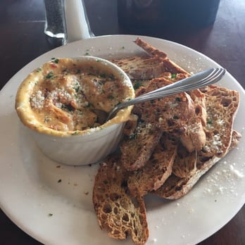FireRock Grille - Baked Brie with sundries tomatoes - New American Near Me - Caledonia, Michigan FireRock Grille - Baked Brie with sundries tomatoes - New American Near Me - Caledonia, Michigan