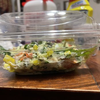 Subway - a salad in a plastic container on a wooden table - Sandwiches Near Me - Wood River, Illinois Subway - a salad in a plastic container on a wooden table - Sandwiches Near Me - Wood River, Illinois