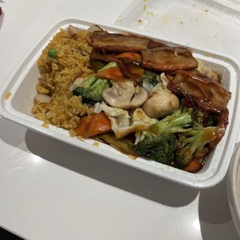 Golden Forest - Dinner combo (roast pork in garlic sauce), egg roll not shown - Chinese Near Me - New York, New York Golden Forest - Dinner combo (roast pork in garlic sauce), egg roll not shown - Chinese Near Me - New York, New York