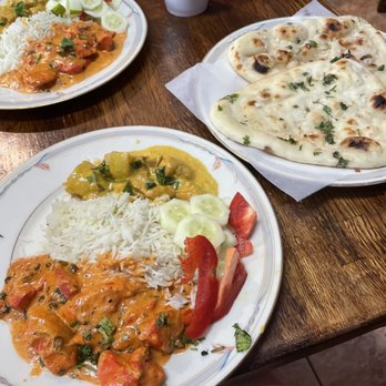 Shalimar Curry House - two plates of food on a table - Indian Near Me - Columbia, South Carolina Shalimar Curry House - two plates of food on a table - Indian Near Me - Columbia, South Carolina