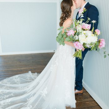 Jenifer Santo Photography - Bride leaning into groom, leaning against a wall kissing. - Event Photography Near Me Jenifer Santo Photography - Bride leaning into groom, leaning against a wall kissing. - Event Photography Near Me