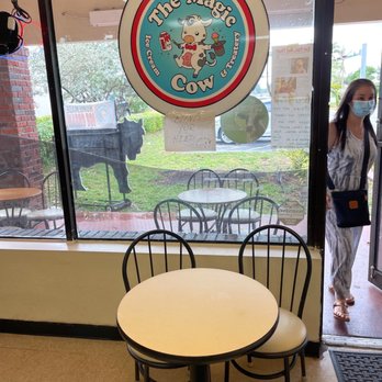 The Magic Cow - a table and chairs in front of a window - Ice Cream & Frozen Yogurt Near Me - Davie, Florida The Magic Cow - a table and chairs in front of a window - Ice Cream & Frozen Yogurt Near Me - Davie, Florida