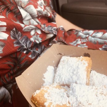 Meaux Beignet - a woman holding a box of beignets - Food Trucks Near Me - Bentonville, Arkansas Meaux Beignet - a woman holding a box of beignets - Food Trucks Near Me - Bentonville, Arkansas