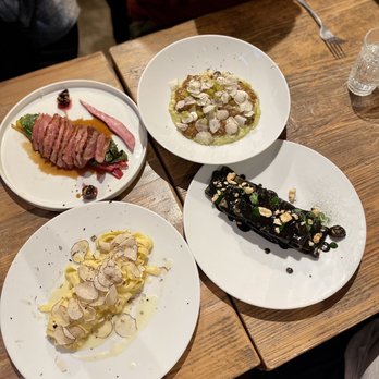 Nugolo - Top left clockwise: duck cherry sauce with leeks, risotto veal check ragout, seafood squid ink pasta, truffle fettuccine butter sauce - Italian Near Me - Florence, FI