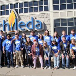 Chileda - Chileda employees standing in front of the Chileda education building.