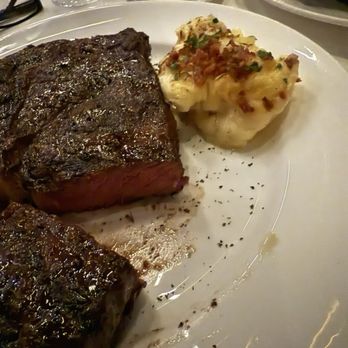 J Prime Steakhouse - Austin - Ribeye and scalloped potatoes - Steakhouses Near Me - Austin, Texas J Prime Steakhouse - Austin - Ribeye and scalloped potatoes - Steakhouses Near Me - Austin, Texas