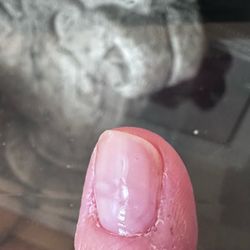 Paint left on from previous manicure, cuticles a mess, she actually painted over the old nail polish.
