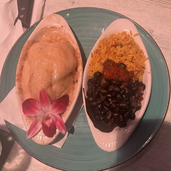 FINS Seafood & Dive Bar - Stuffed flounder with side of black beans and rice - Seafood Near Me - Cape Coral, Florida FINS Seafood & Dive Bar - Stuffed flounder with side of black beans and rice - Seafood Near Me - Cape Coral, Florida