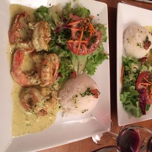 Photo of Le Jardin d'en Face - Paris, France. King prawns with herb butter sauce