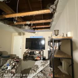 Real Property Management Preferred - Living room with roof collapsed. Totally not a big deal though, right????