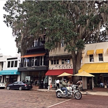 Briarpatch Restaurant - yellow awnings, trees, lines out the door = briar patch - American Near Me - Winter Park, Florida