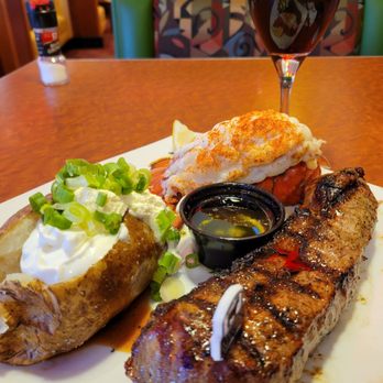 Sizzler - A glass of merlot goes perfectly with Sizzler's 8oz. Steak and Lobsster with baked potato on the side. - Seafood Near Me - Manteca, California Sizzler - A glass of merlot goes perfectly with Sizzler's 8oz. Steak and Lobsster with baked potato on the side. - Seafood Near Me - Manteca, California