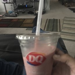 a hand holding a drink a hand holding a drink