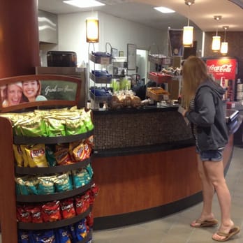 The Side Bar @ Mercer Law - a woman standing in front of a counter - Cafes Near Me - Macon, Georgia The Side Bar @ Mercer Law - a woman standing in front of a counter - Cafes Near Me - Macon, Georgia
