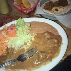 Carne guisada plate with guacamole.