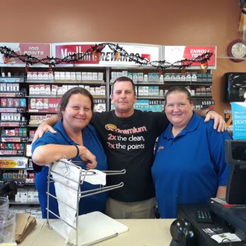 Express Mart - two women and a man in a store - Convenience Stores Near Me - Bridge City, Texas