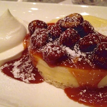 Aria - Warm Chèvre Cheesecake (this time of year it's topped with crispy hazelnuts in a caramel sauce) & soft whipped cream. - New American Near Me - Atlanta, Georgia Aria - Warm Chèvre Cheesecake (this time of year it's topped with crispy hazelnuts in a caramel sauce) & soft whipped cream. - New American Near Me - Atlanta, Georgia