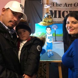 Myself, my son and Micha. His painting done by her in the back. Myself, my son and Micha. His painting done by her in the back.