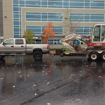Cornerstone MG - a truck with a crane on the back of it - General Contractors Near Me