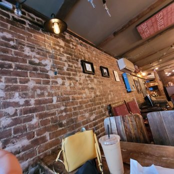 Black Cat LES - Exposed brick walls. - Coffee & Tea Near Me - New York, New York