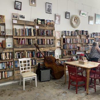The Author Shoppe - a woman sitting at a table in front of a bookshelf - Coffee & Tea Near Me - Hattiesburg, Mississippi The Author Shoppe - a woman sitting at a table in front of a bookshelf - Coffee & Tea Near Me - Hattiesburg, Mississippi