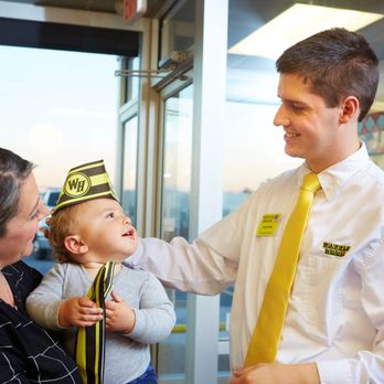 Waffle House - a man in a yellow tie holding a baby - Breakfast & Brunch Near Me - Arab, Alabama