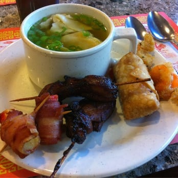 Super Buffet - a bowl of soup and a plate of meat skewers - Buffets Near Me - East Greenbush, New York