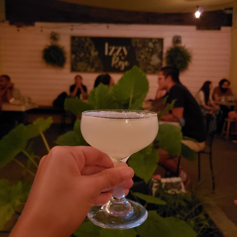 Izzy Rose - a person holding a glass of wine - Cocktail Bars Near Me - Brooklyn, New York Izzy Rose - a person holding a glass of wine - Cocktail Bars Near Me - Brooklyn, New York
