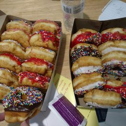 two boxes of donuts with sprinkles two boxes of donuts with sprinkles