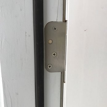 Raindrop Landscape & Maintenance - Cracked both door frames and only used three screws where four was required in all cases. Here is a picture that shows both crack and screw. - Landscaping Near Me Raindrop Landscape & Maintenance - Cracked both door frames and only used three screws where four was required in all cases. Here is a picture that shows both crack and screw. - Landscaping Near Me