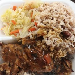 Jerk chicken with rice and beans and steamed cabbage