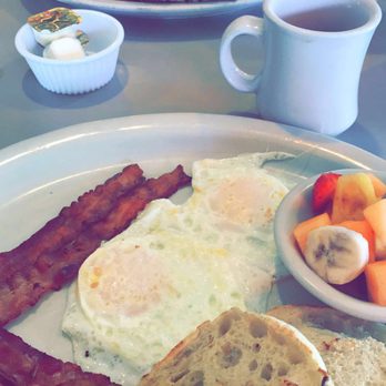 Village Cafe - 2 Eggs your way with a side of bacon, fresh fruit, and an English muffin. Don't forget some coffee too! - American Near Me - Siesta Key, Florida Village Cafe - 2 Eggs your way with a side of bacon, fresh fruit, and an English muffin. Don't forget some coffee too! - American Near Me - Siesta Key, Florida