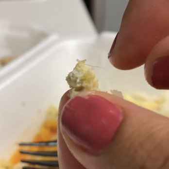 Jimmy's Egg - a hand holding a piece of food - Breakfast & Brunch Near Me - Oklahoma City, Oklahoma