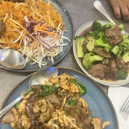 Pad See Ew, Pad Thai, and stir fry broccoli. Pad See Ew, Pad Thai, and stir fry broccoli.