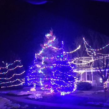 Aarons Lawn Service - a lighted christmas tree - Gutter Services Near Me