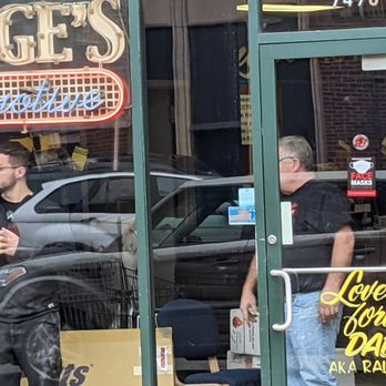 Runge's Auto & Tire - The owner and an employee not wearing a mask inside. Note the sign on the door that says 'face masks required.' - Tires Near Me - Chicago, Illinois