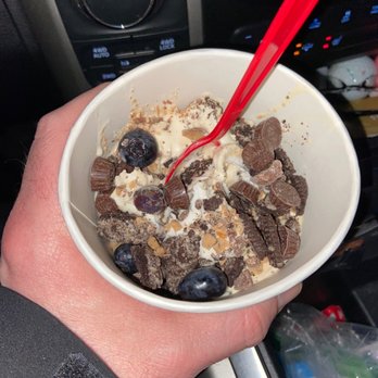 Smart Cow Yogurt Bar - a hand holding a bowl of yogurt - Desserts Near Me - Green Bay, Wisconsin Smart Cow Yogurt Bar - a hand holding a bowl of yogurt - Desserts Near Me - Green Bay, Wisconsin