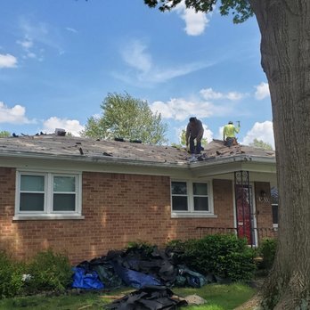 KRC Roofing and Construction - Front of the house removing shingles - Roofing Near Me